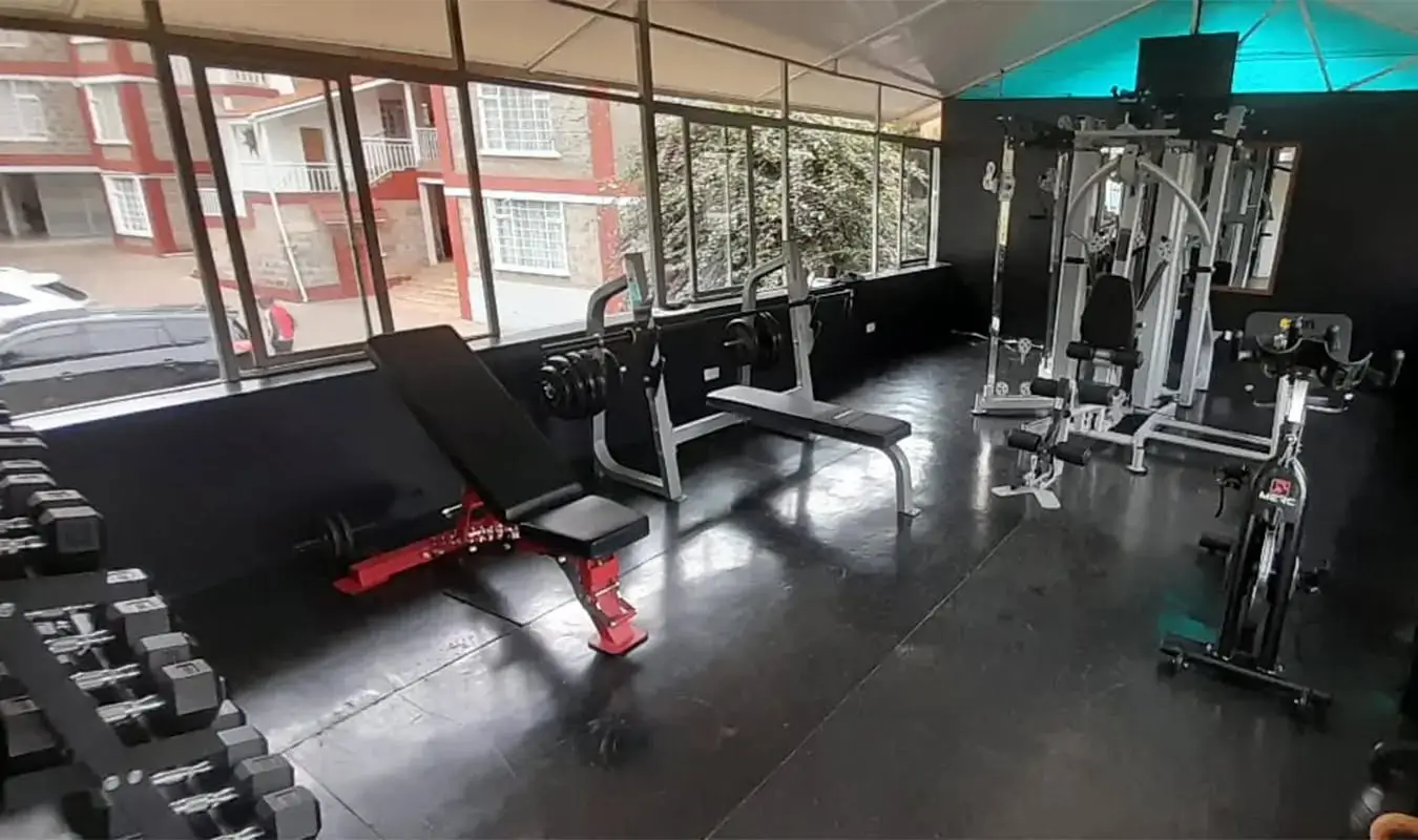 Modern gym with cardio equipment and weight training stations