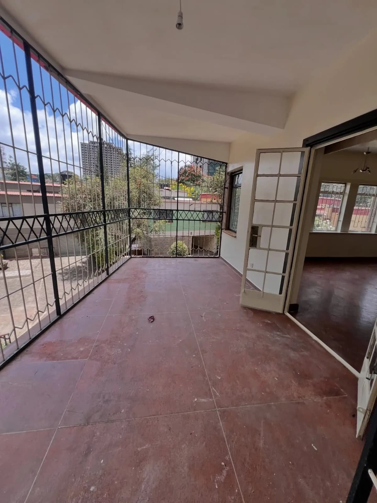 Spacious balcony with city views and protective railing