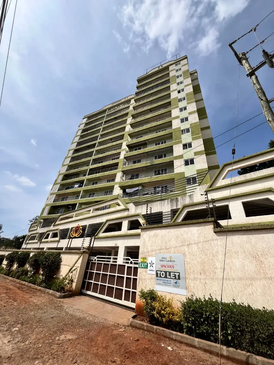 Multi-story residential building with street entrance gate