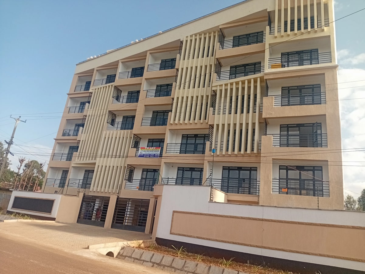 Modern multi-story residential building facade with balconies
