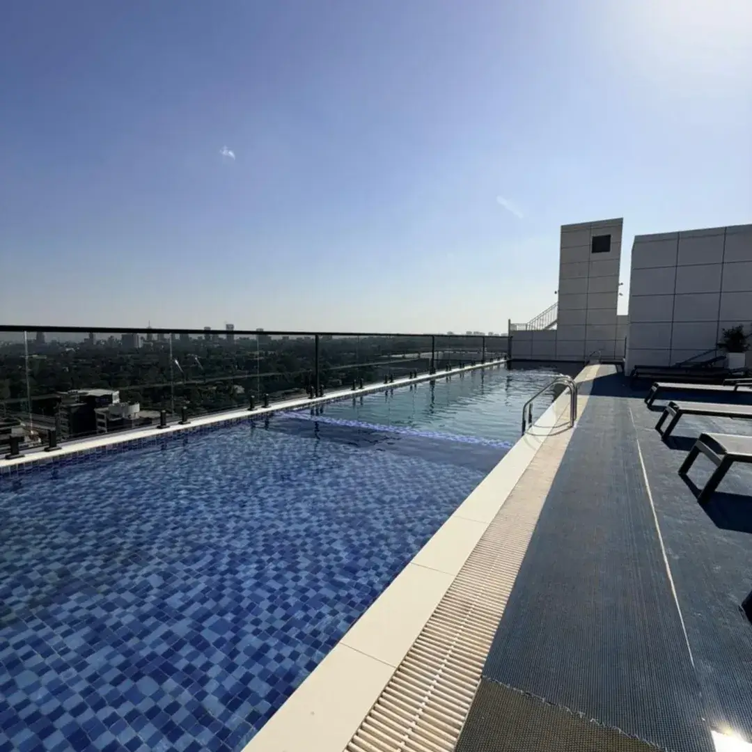 Rooftop swimming pool with city skyline views