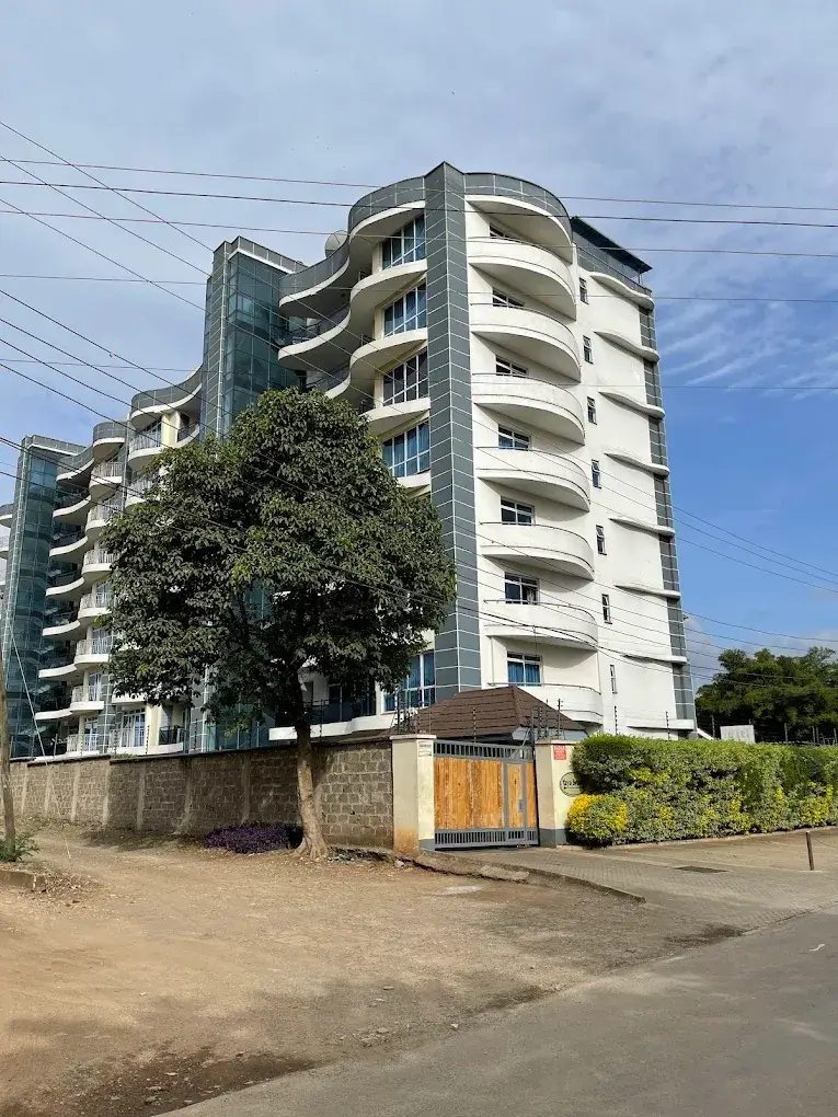 Modern multi-story apartment building with curved balconies